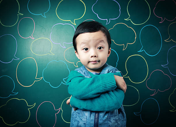istock Cute child in front of the blackboard 472085587