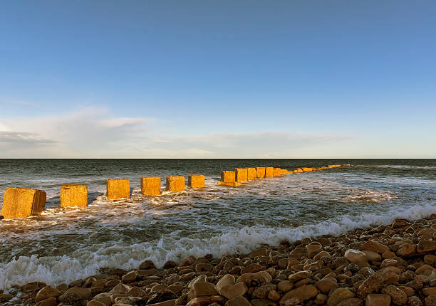 Lossiemouth, East beach in winter. This is East Beach with it's WW11 Anti Tank Concrete boxes in Lossiemouth, Moray, Scotland, United Kingdom. This was on a sunny winters day. moray firth stock pictures, royalty-free photos & images