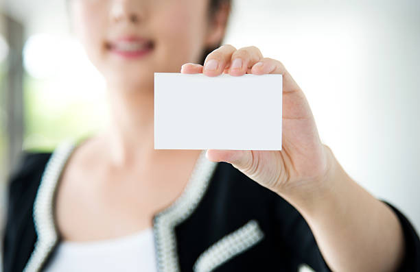 istock holding a business card 472086479