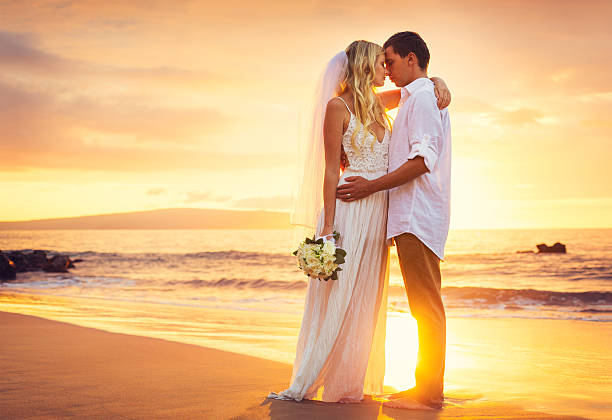 Bride and Groom, Beautiful Tropical Beach at Sunset stock photo