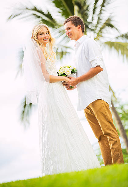 istock Bride and Groom, Romantic Newly Married Couple Holding Hands 472087749