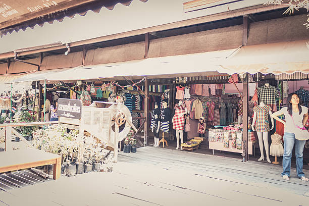 Phra Nakhon Si Ayutthaya, Thailand - April 14, 2015: Ayothaya Floating Market. Has a many visitors, both Thais and foreign visitors with varieties of Thai clothes and Thai food at Ayutthaya,Thailand