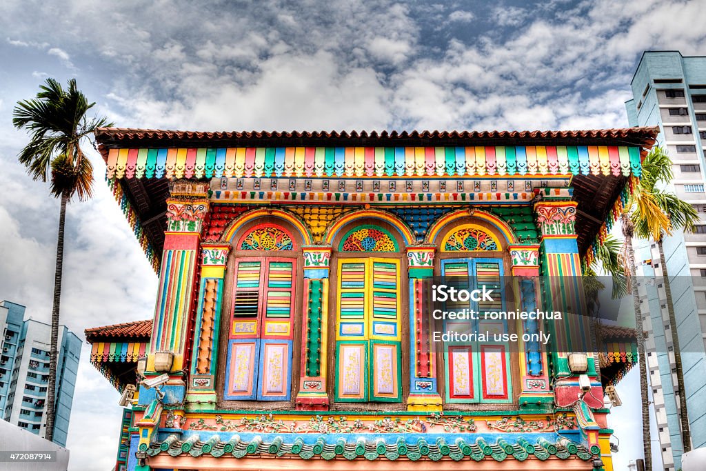 Singapore Landmark: Colorful building facade in Little India Singapore, Singapore - March 24, 2015: The colorful house of Tan Teng Niah sits proudly at the center of Little India in Singapore. The history of this eight-room Chinese villa goes back to 1900 when Tan Teng Niah, who was one of few prominent Chinese businessmen in Little India, built it for his wife. This building is the last surviving Chinese villa in Little India.  2015 Stock Photo