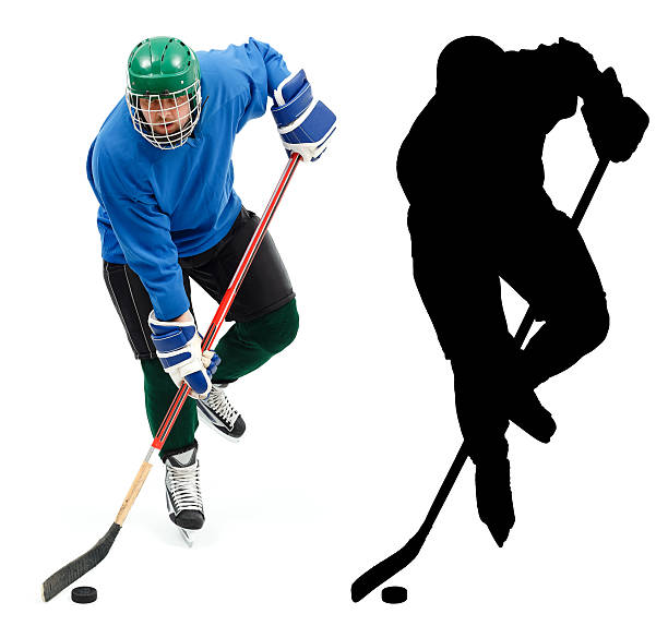 Ice hockey player and it's silhouette stock photo