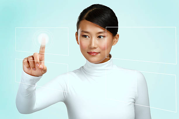istock Young asian woman working on a futuristic touchscreen 472089353