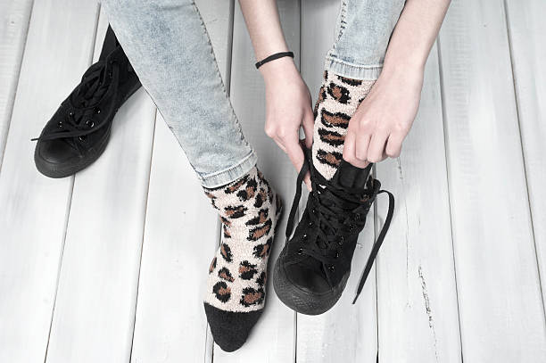 istock Woman puts on her sneakers 472091328