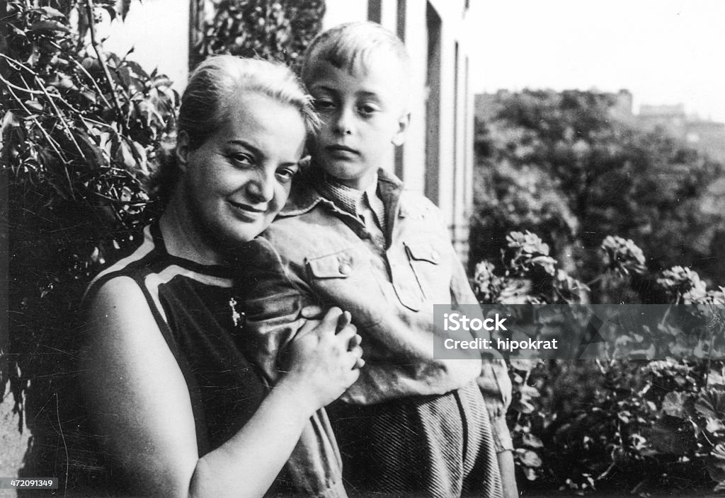 Old black and white photograph of a mother and a son forties Adult Stock Photo