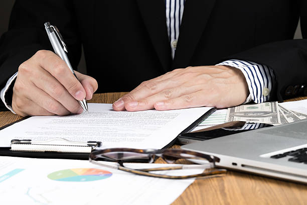 istock businessman signing marketing contract. 472091960