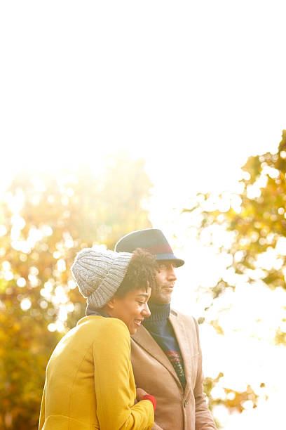 istock Happy couple together in autumn park 472092135
