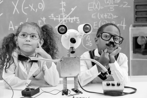 Retro revival image of children in a science lab creating their own robot.  They are deep in thought! 