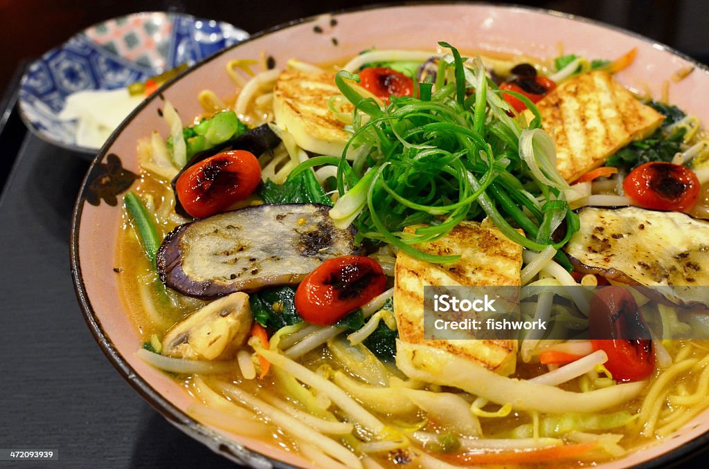 Vegetarian ramen noodles Japanese ramen noodles in soup, serve with grilled eggplants, tofu, tomatoes, green onions, mushrooms and bean sprouts  Bean Sprout Stock Photo