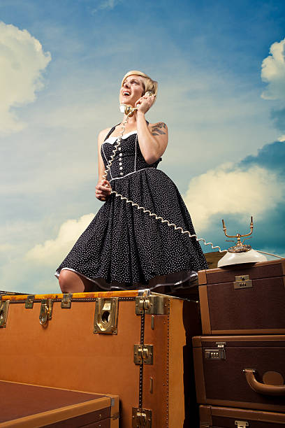 istock Retro Traveling Girl Making Phone Call 472093985