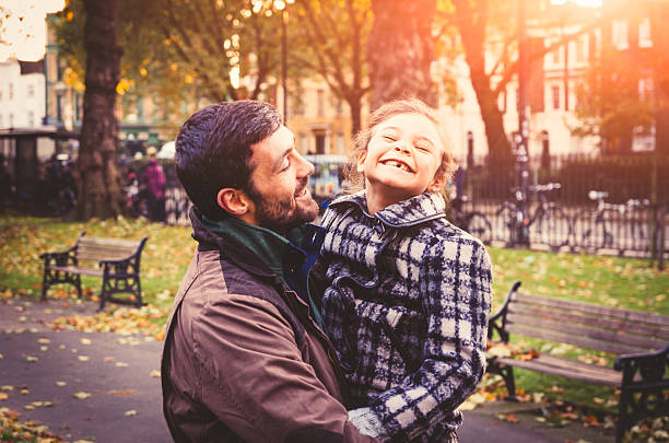 istock Father And Daughter Having Fun In The Park 472094709
