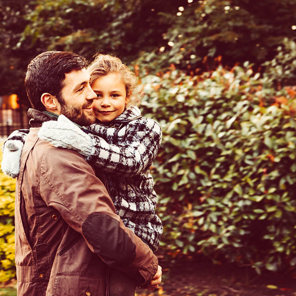 istock Father And Daughter Having Fun In The Park 472094713