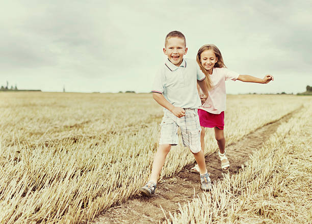 istock Brother and sister in the field. 472094765