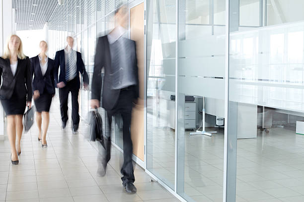 istock Businesspeople in corridor 472094800