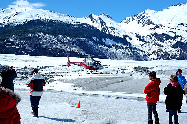 Juneau, Alaska - May 20, 2013: Visitors are exploring the Mendenhall Glacier in Juneau, Alaska