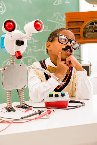 éducation: retour du rétro garçon faisant robot en science lab. - child back to school mustache african ethnicity photos et images de collection