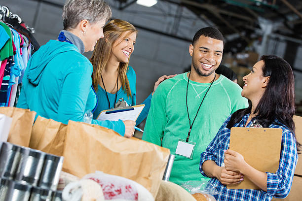 istock Diverse group of volunteers sorting donations at food bank 472096477