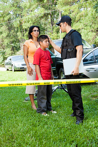 istock Policeman questioning witnesses during crime investigation. 472096487