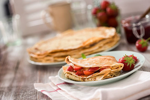 Strawberry Crepes Homemade crepes with fresh strawberries crêpe pancake stock pictures, royalty-free photos & images