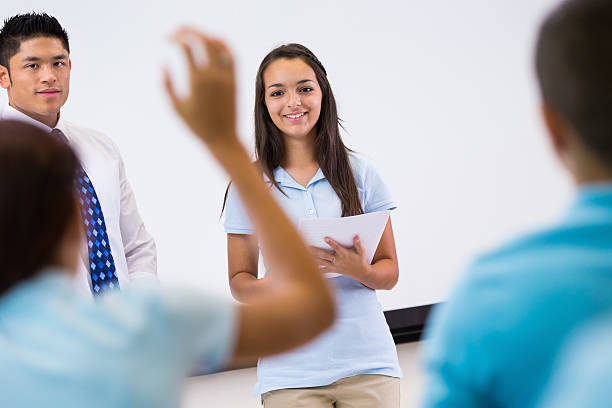 istock Private school student giving presentation in front of classmates 472097801