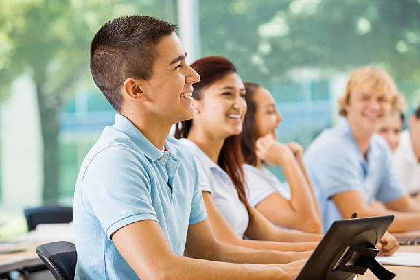 istock Students listening in private high school classroom 472098281