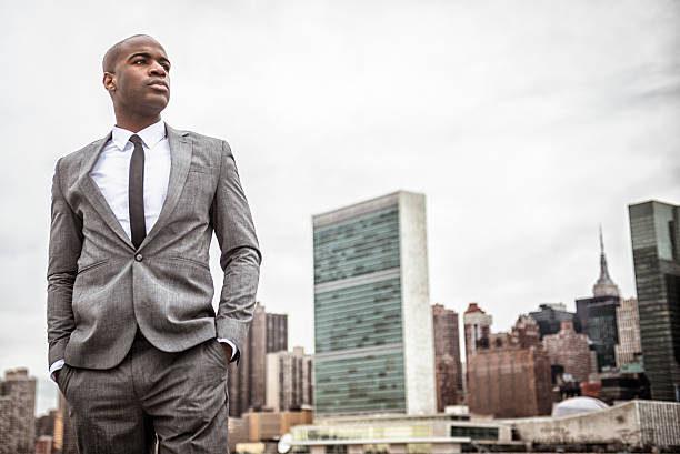 istock Successful business man looking away against the skyline 472098767