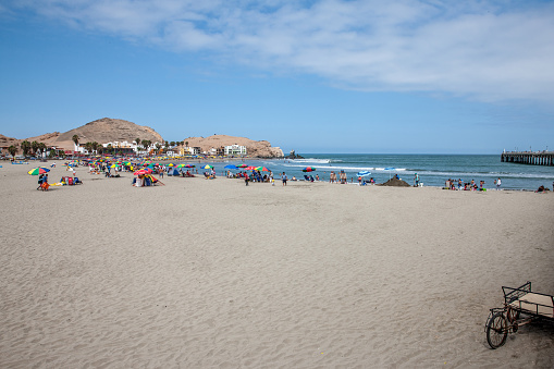 San Pedro, Peru - January 18, 2015: People enjoying the beach on Peruvian Pacific coast at San Pedro south of Lima