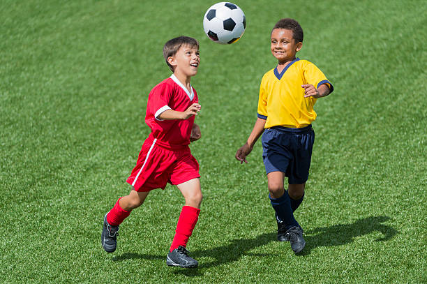 istock Two Young Boys Playing Football 472099177