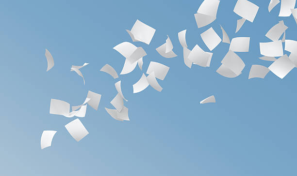 white papers - flying paper stock-fotos und bilder