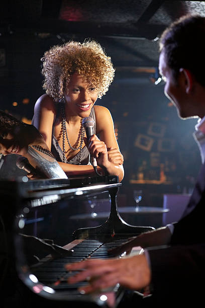 istock Singer And Pianist On Stage 472101259
