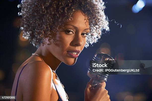 Female Singer With Natural Hair Holding Old Style Microphone Stock Photo - Download Image Now