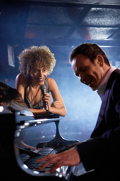 istock Singer And Pianist On Stage 472101323