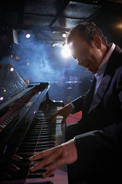 istock Pianist Performing In Jazz Club 472101329