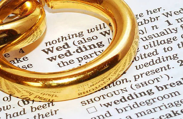 wedding definition word in dictionary with golden weddingrings
