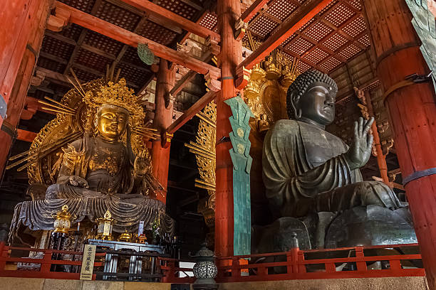The Great Buddha and kokuzo bodhisattva at Todaiji Temple Nara, Japan - November 16 2013: Daibutsu-den houses the world's largest bronze statue of the Buddha Vairocana and other two Bodhisattava nsra stock pictures, royalty-free photos & images