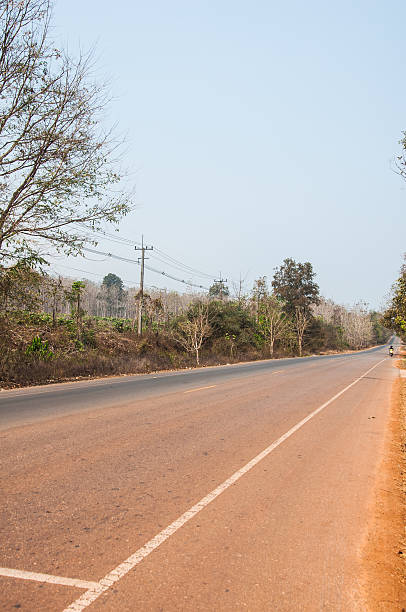 istock Road in thailand countryside forest 472105712