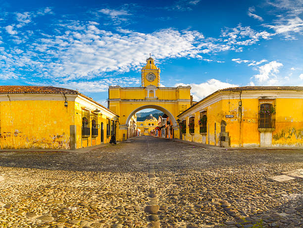 santa catalina arch in antigua downtown low camera position for shot of the Arch of Santa Catalina in Antigua, Guatemala - one of the icons of this town. guatemala stock pictures, royalty-free photos & images