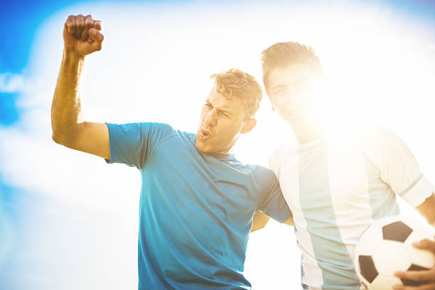 istock Soccer players celebrating the victory 472108451