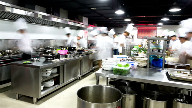 modern kitchen and busy chefs, time lapse.