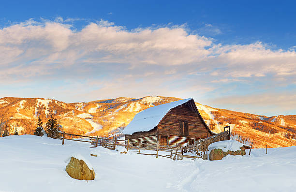 old barn and mountains in steamboat spring - colorado