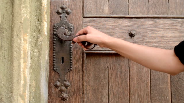 Woman Push Old Door Handle