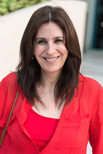 istock Smiling mature hispanic woman 472110707