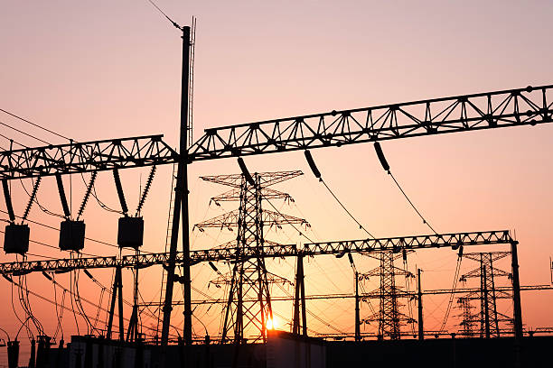 istock Electrical Power Lines and Pylons with  Sunset 472111427