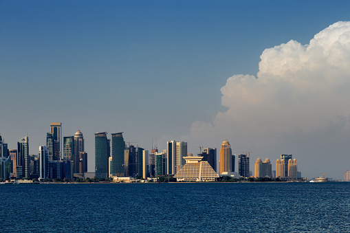 Doha, Qatar - November 14, 2013: conic new towers grace the skyline of the West Bay area of Doha, Qatar. The West Bay is considered as one of the most prominent districts of Doha