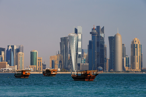 Doha, Qatar - November 15, 2013: The West Bay City skyline as viewed from The Grand Mosque in Doha, Qatar. The West Bay is considered as one of the most prominent districts of Doha