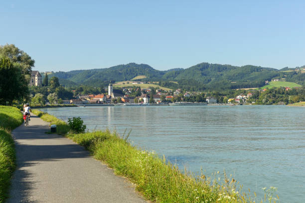 bcycle path to grein near danube river at austria grein, austria - August 20, 2012:People are riding bcycle at cycle path near danube river at grein austria grein austria stock pictures, royalty-free photos & images