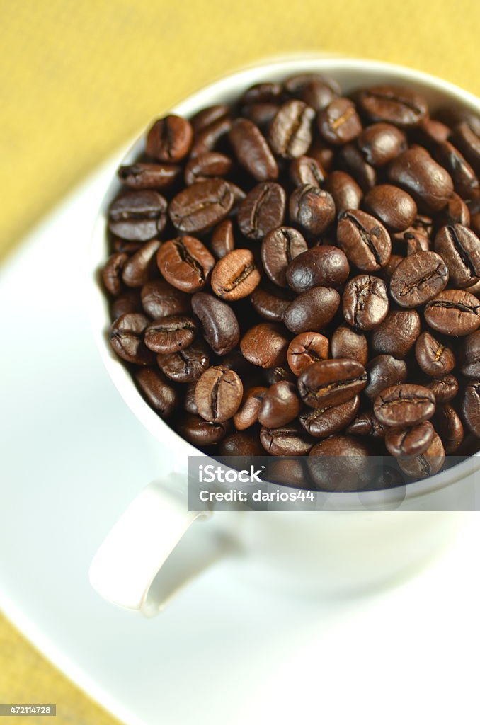 white coffee cup full of coffee beans 2015 Stock Photo