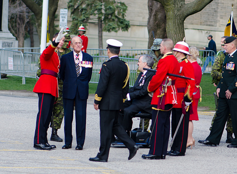 Toronto, Canada- April 27,2013:  Prince Philip, the Duke of Edinburgh  visits Canada to present the new Colours to the 3rd Battalion of the Royal Canadian Regiment. The ceremony takes place in front of the Queen's Park Legislative Assembly of Ontario. His Royal Highness is the Colonel-in-Chief of the Royal Canadian Regiment since December 1953